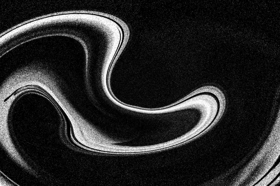 Abstract black-and-white metallic swirl texture.