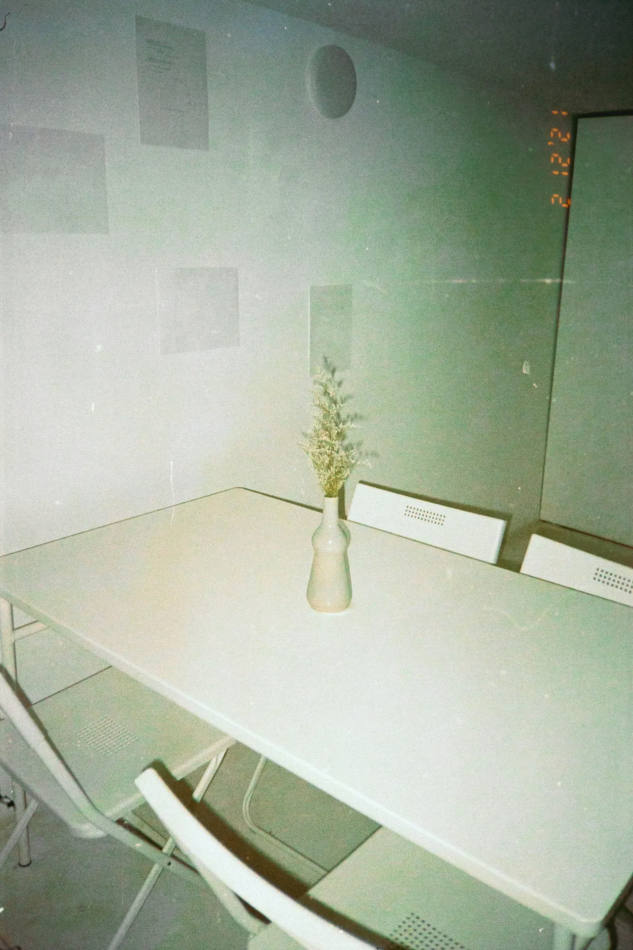 Soft minimalist still life with pale tones and an editorial atmosphere.