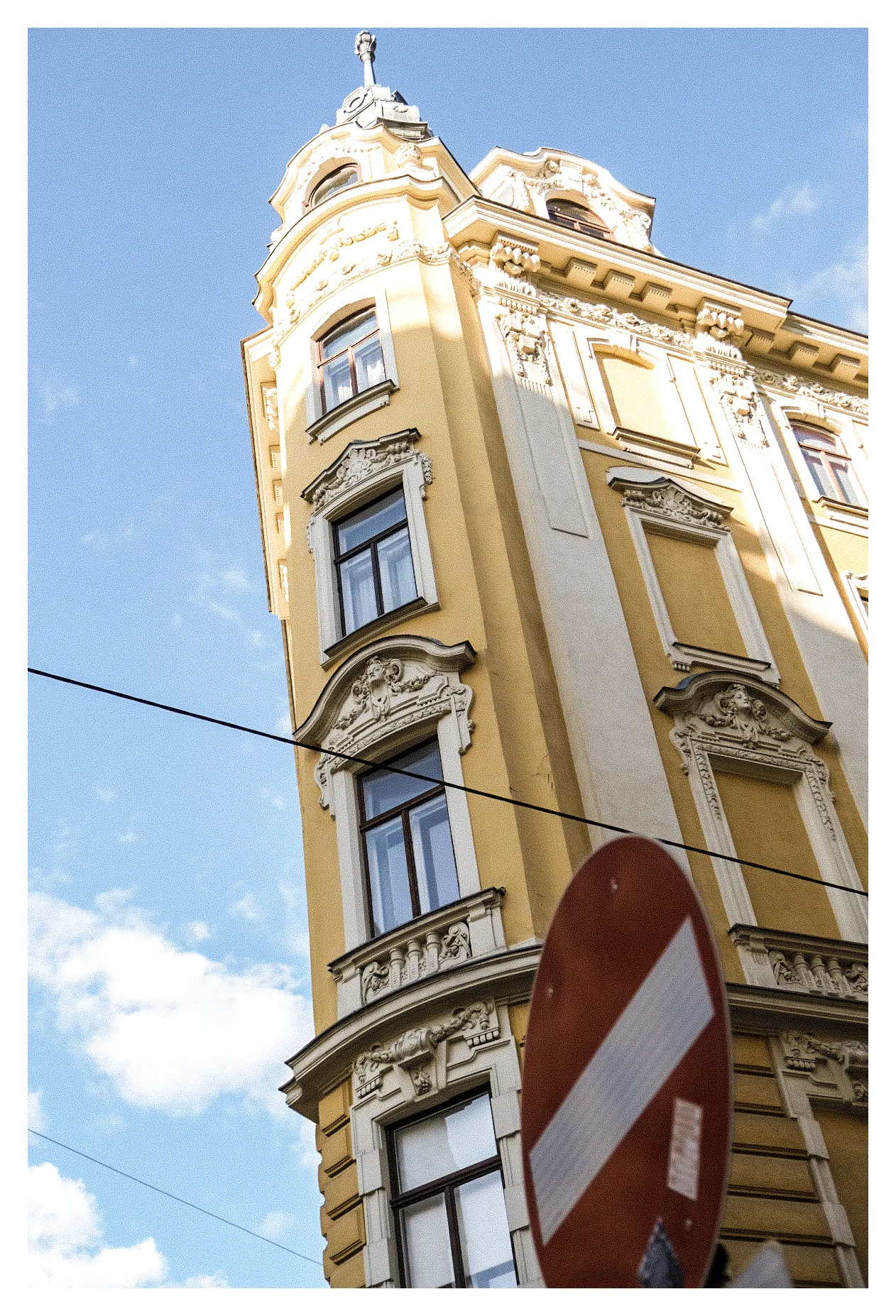 Sunny building facade photographed from below